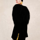 Langry elegant business blazer in black fur with gold trim and oversized yellow earrings, fashion ملابس
