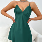 Emerald green satin langry slip dress with v-neckline and spaghetti straps