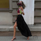 Stylish woman with flowers in winter petal design long skirt