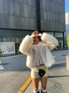 Langry cream fluffy faux fur coat with cropped fit and oversized sleeves