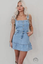 Office suspenders denim dress with light-wash mini style, button bodice, ruffled hem