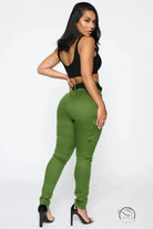 Woman in green cargo pants, casual skinny stretch belt sports style