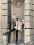 Langry faux fur winter jacket with black leather pants and silver boots