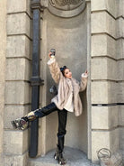 Langry faux fur winter jacket with black leather pants and silver boots