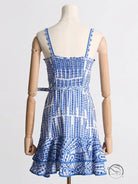 Blue and white machine embroidery sundress with spaghetti straps and ruffled hem