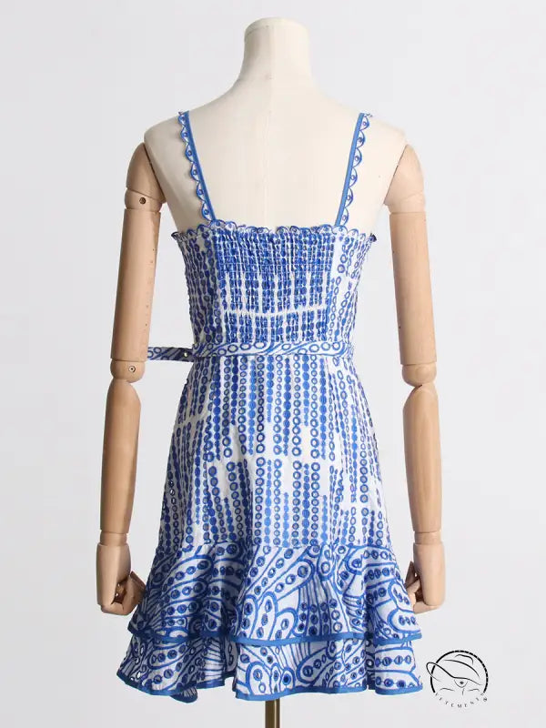 Blue and white machine embroidery sundress with spaghetti straps and ruffled hem