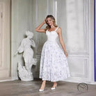 Woman in gentle three dimensional camellia chiffon dress
