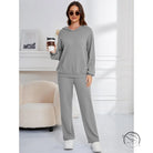 Woman in gray ribbed hooded casual suit lounge set