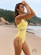 Stunning mesh swimsuit in yellow with side cutouts and drawstring