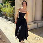 Elegant black spaghetti-strap backless sling dress
