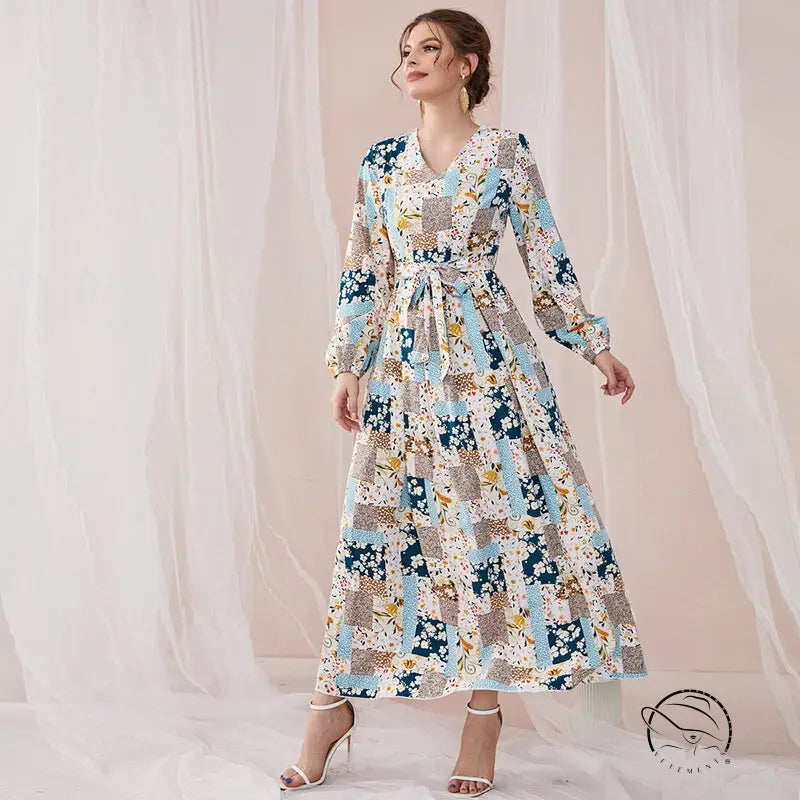 Woman in floral print slim fit maxi dress with blue beige white patchwork