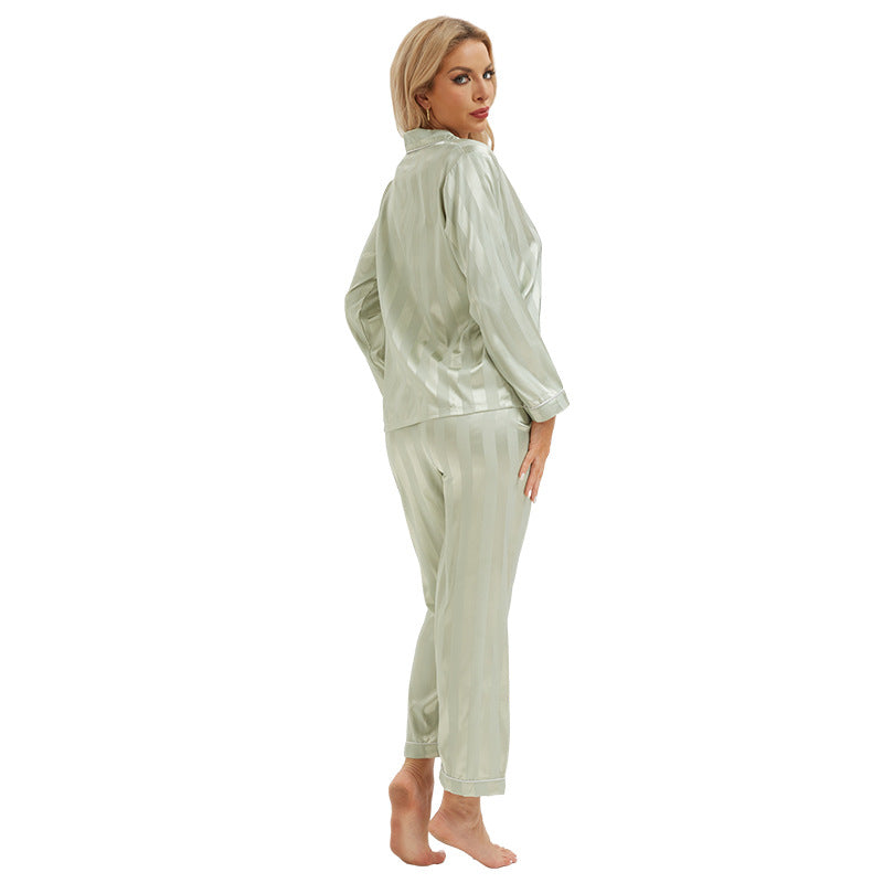 Woman in light green langry fashion pajamas with bold stripes