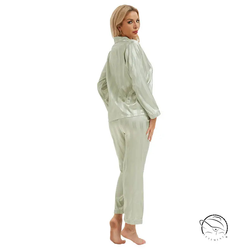 Woman in light green satin langry pajamas, long sleeves and tapered pants, fashion ملابس