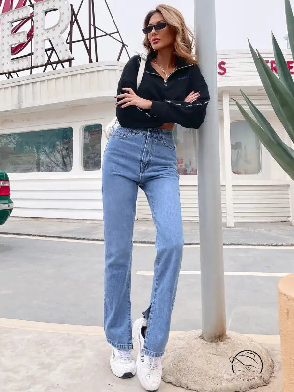 Women’s light wash high-waisted straight-leg denim pants with front slits