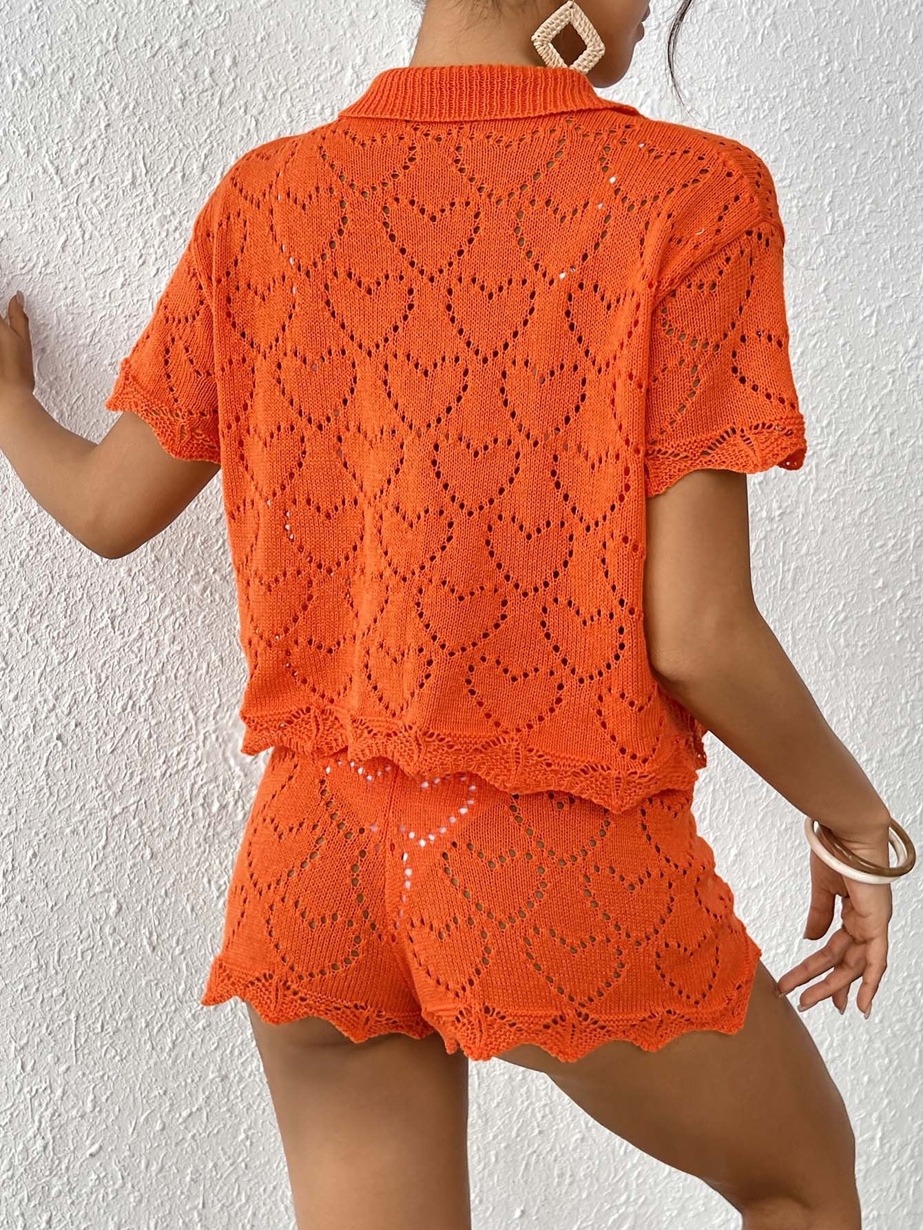 Orange knit two-piece set for women featuring stylish sleeve length, ideal for beach fashion