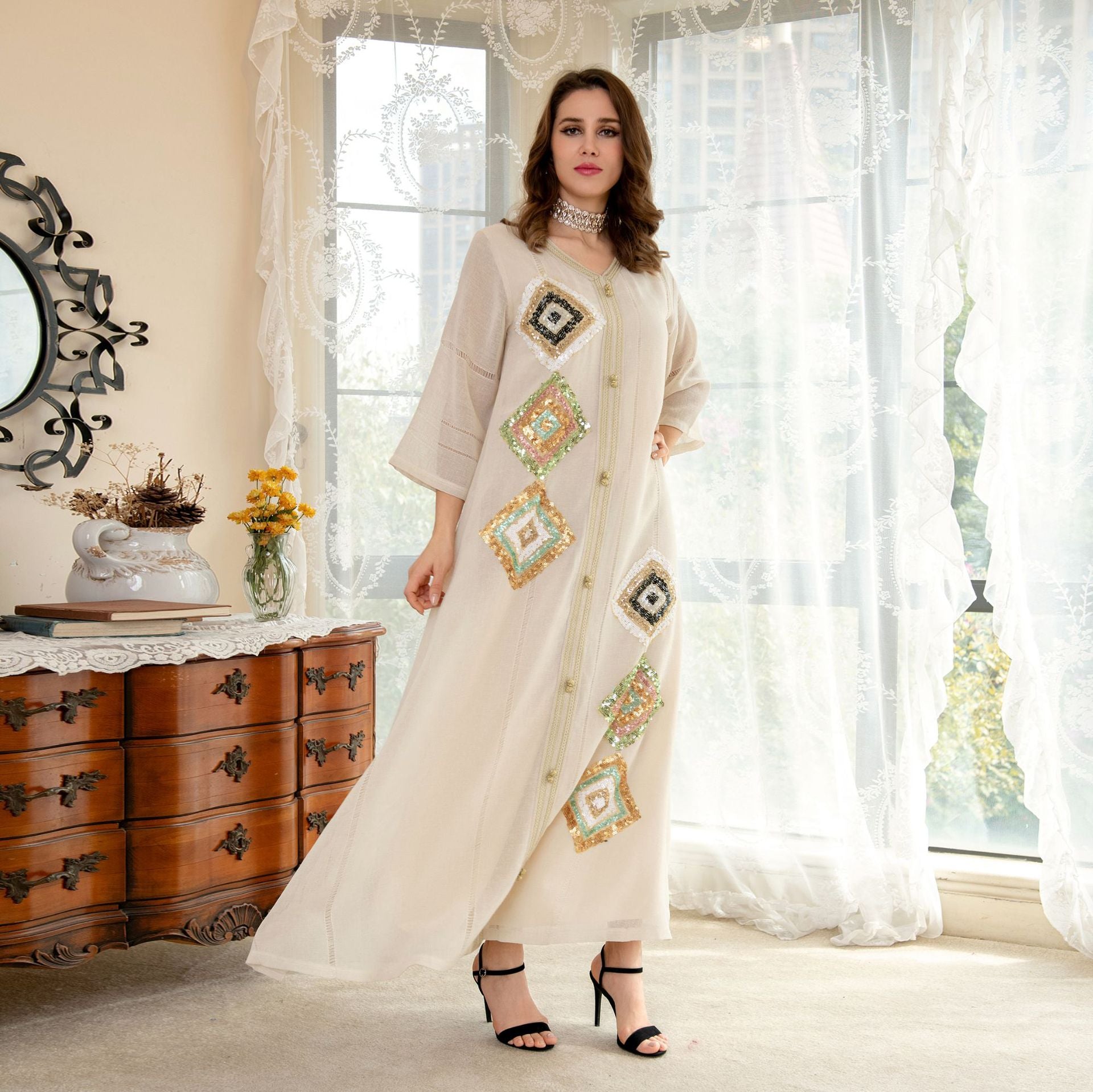 White embroidered maxi dress in Langry fashion with geometric patterns and lace trim