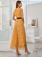 Elegant yellow floral maxi langry dress with black waist belt in fashion style