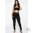 Woman in black crop top and casual skinny stretch belt sports pants