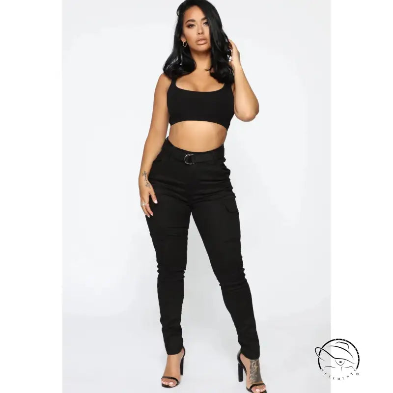 Woman in black crop top and casual skinny stretch belt sports pants