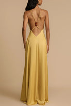 Elegant satin maxi dress in yellow backless design, perfect for stylish fashion statements