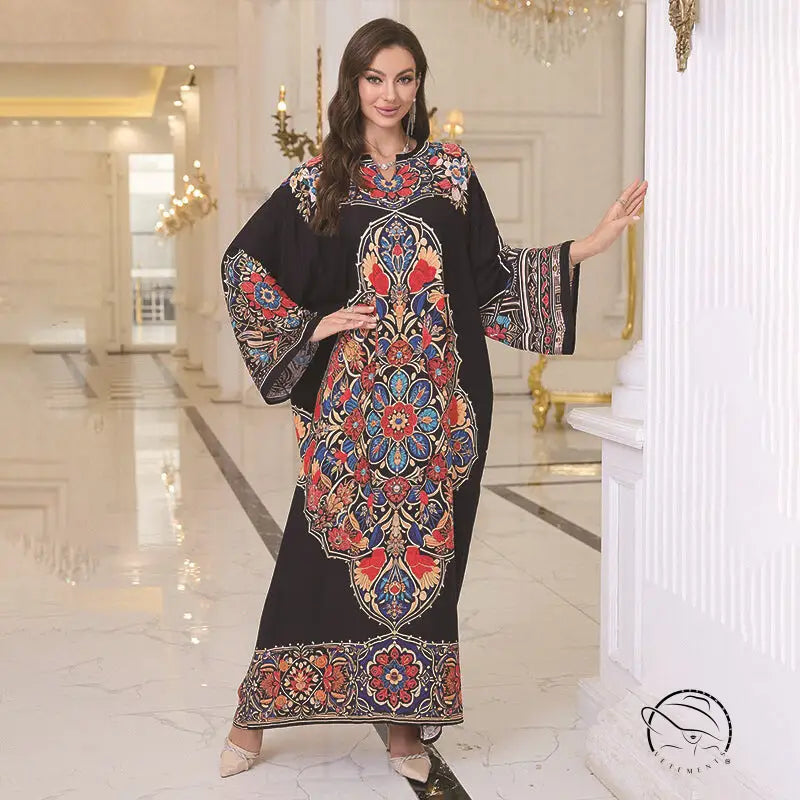 Elegant loose black kaftan dress with colorful floral pattern and bell sleeves