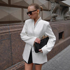 Langry fashion black clutch with gold-tone clasp in white slim-fit blazer