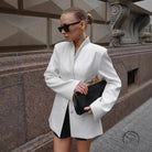 Langry fashion black clutch with gold-tone clasp in white slim fit blazer