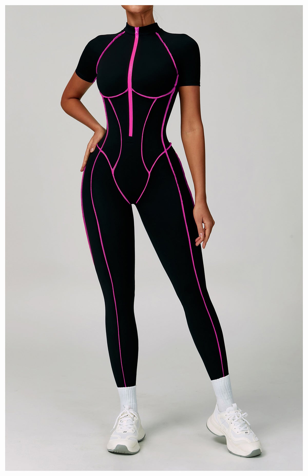 Black and pink spiderweb Langry fashion jumpsuit with white sneakers