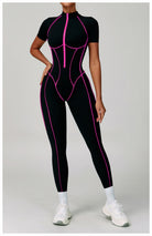 Black and pink spiderweb Langry fashion jumpsuit with white sneakers
