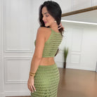 Woman in green crocheted two-piece outfit from Langry Summer fashion ملابس collection