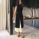 Langry fashion black and white sleeveless jumpsuit with side slit, high waist, open back