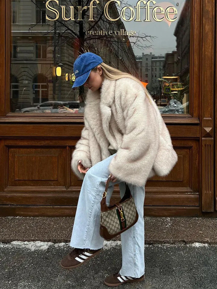 Fashionable faux fur coat with beige Gucci shoulder bag