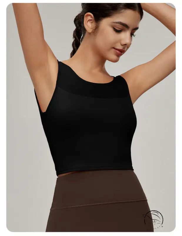 Woman in black mesh workout top and brown leggings, Langry fashion