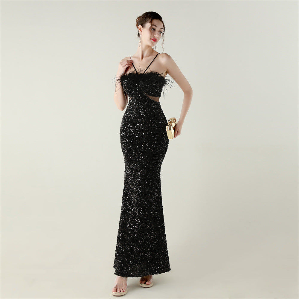 Black sequined mermaid gown with ostrich feather accents in Langry fashion