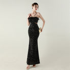 Black sequined mermaid gown with ostrich feather accents in Langry fashion