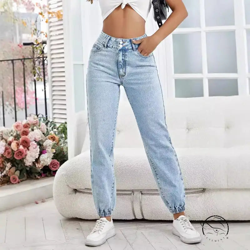 Drooping loose denim pants in light wash with elasticized waist and cuffs