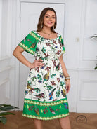 Elegant bohemian dress with white floral print, green trim, square neckline