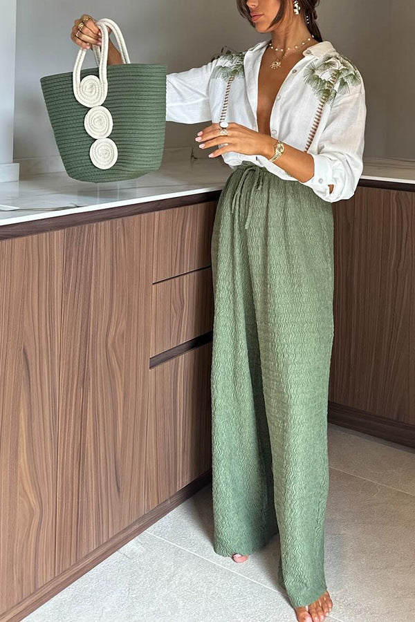 Casual white collared shirt with green embroidery and wide-leg green pants in langry fashion