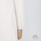 White tweed jacket sleeve on langry fashion off-shoulder dress