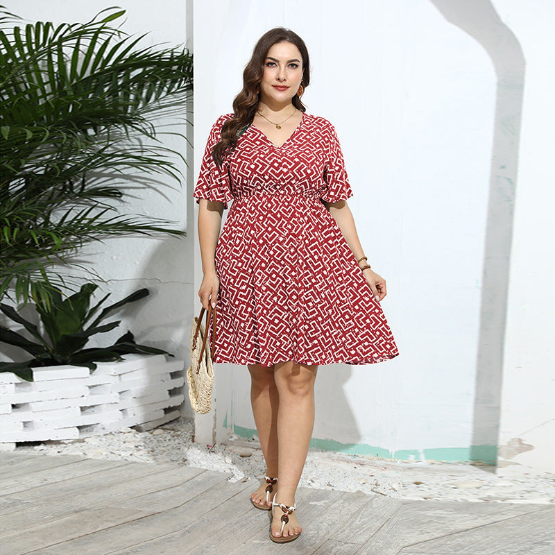 Red and white geometric print wrap dress with flutter sleeves for casual fashion style