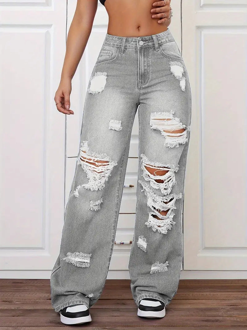 Gray distressed high-waisted langry jeans with white stitching and black sneakers