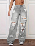 Gray ripped washed high-waist denim trousers with white stitching and black sneakers in langry fashion