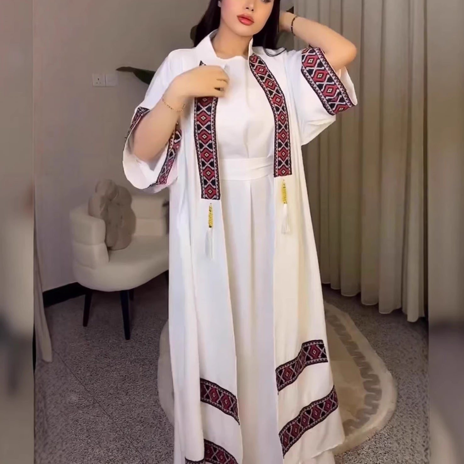 White embroidered maxi dress in langry fashion with red black geometric patterns