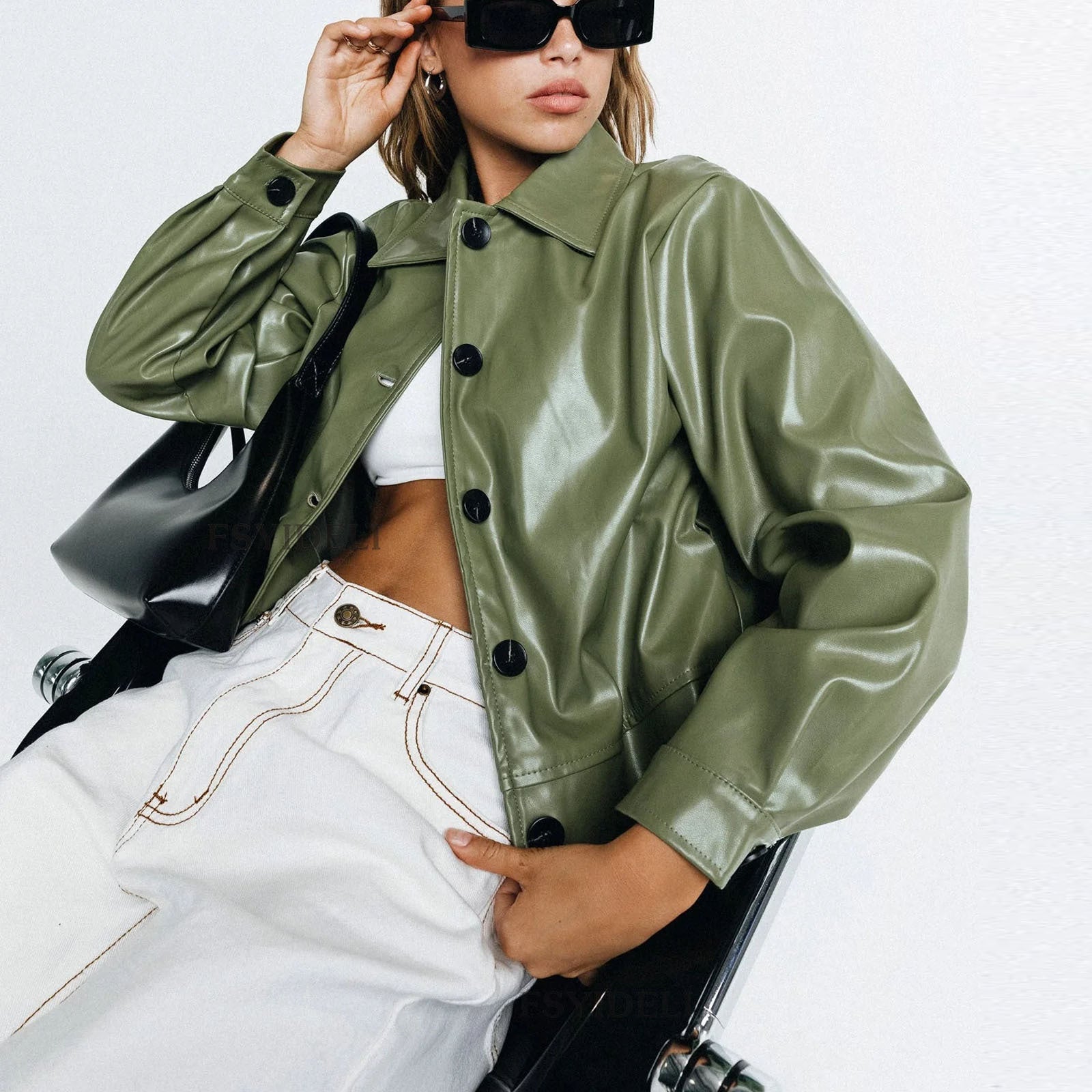 Langry faux leather jacket in olive green with black buttons and white cropped jeans