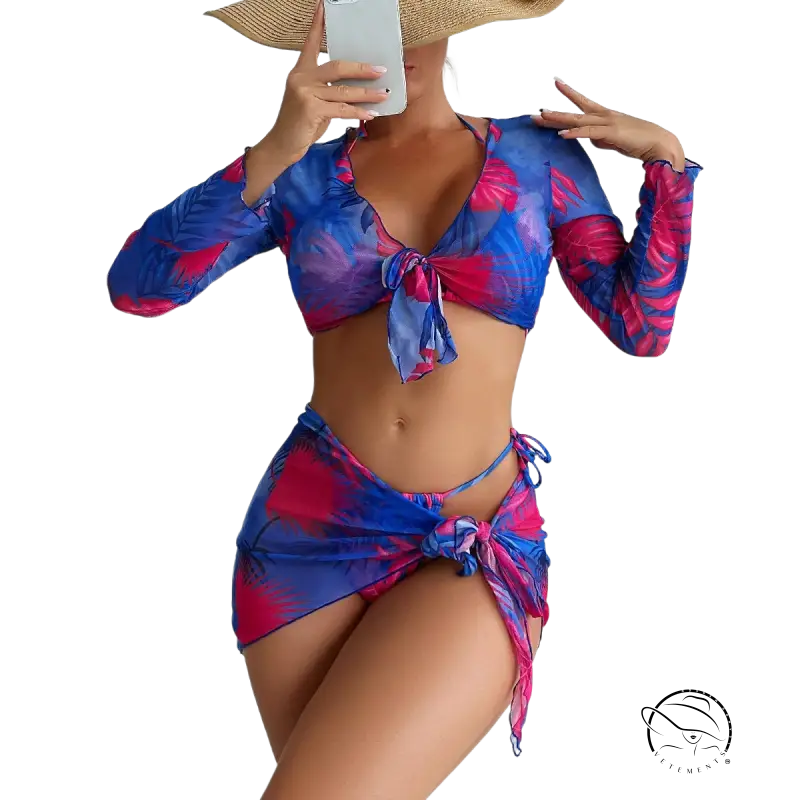 Four piece lace up swimsuit in vibrant blue and pink tropical leaves on red floral background