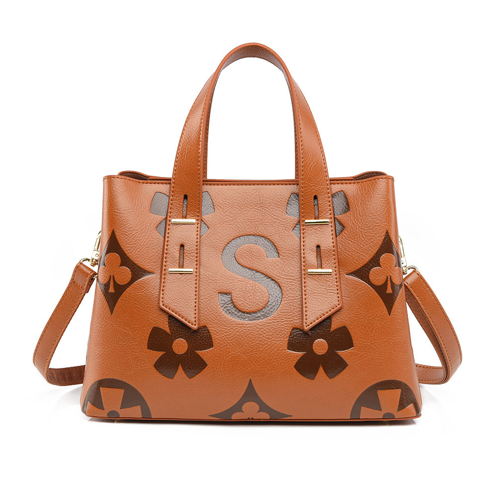 Langry fashion cognac Louis Vuitton satchel with floral bow