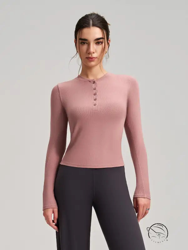 Soft rose-colored ribbed langry fashion top with buttoned crew neckline