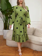Green lotus leaf dress with black polka dots and ruffled hem