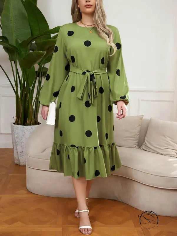 Green lotus leaf dress with black polka dots and ruffled hem