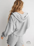 Light gray cozy loose hooded sweatshirt from behind on blonde wavy hair model, langry fashion ملابس